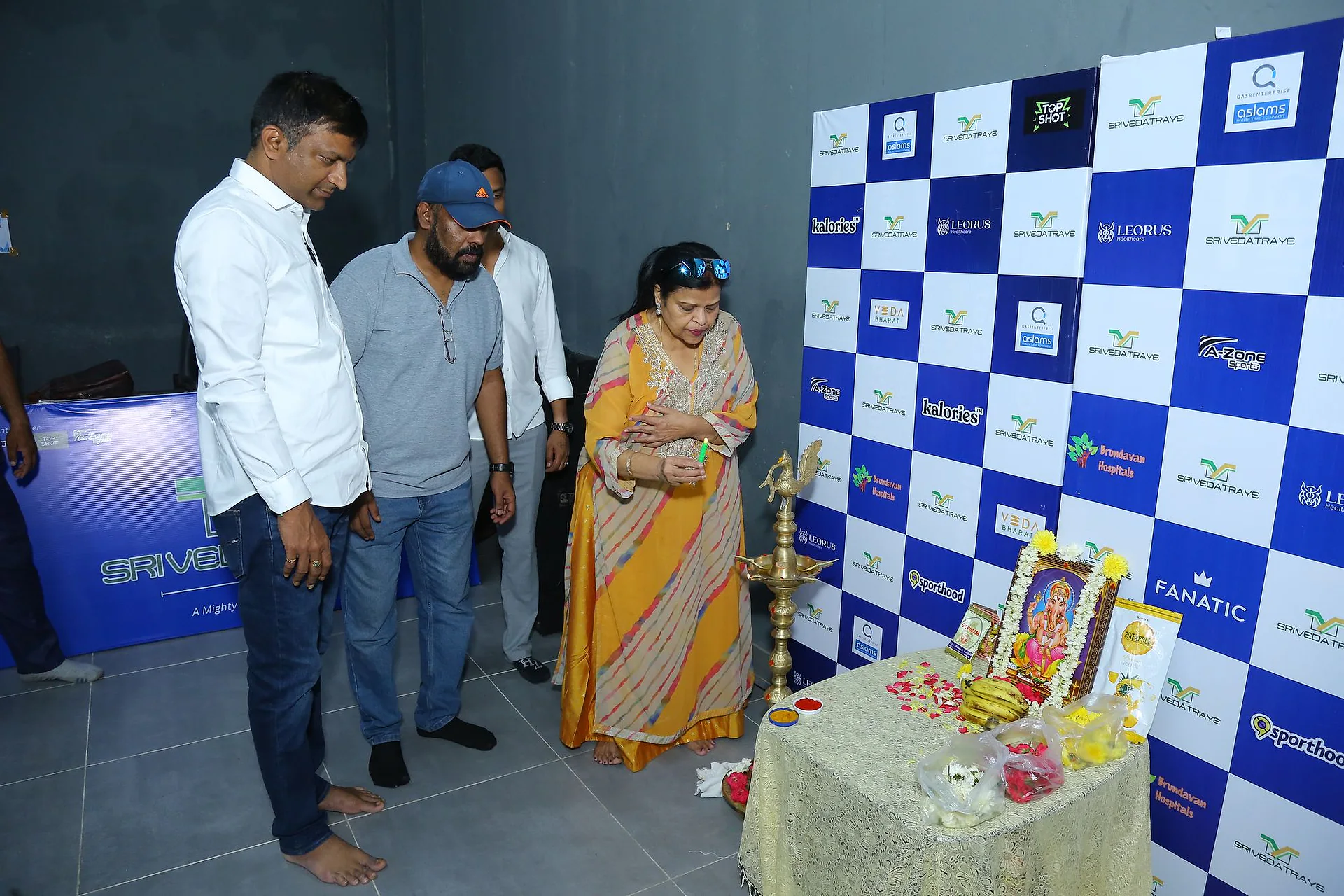 A guest lighting the traditional lamp at the inauguration of the Doctors Badminton Championship