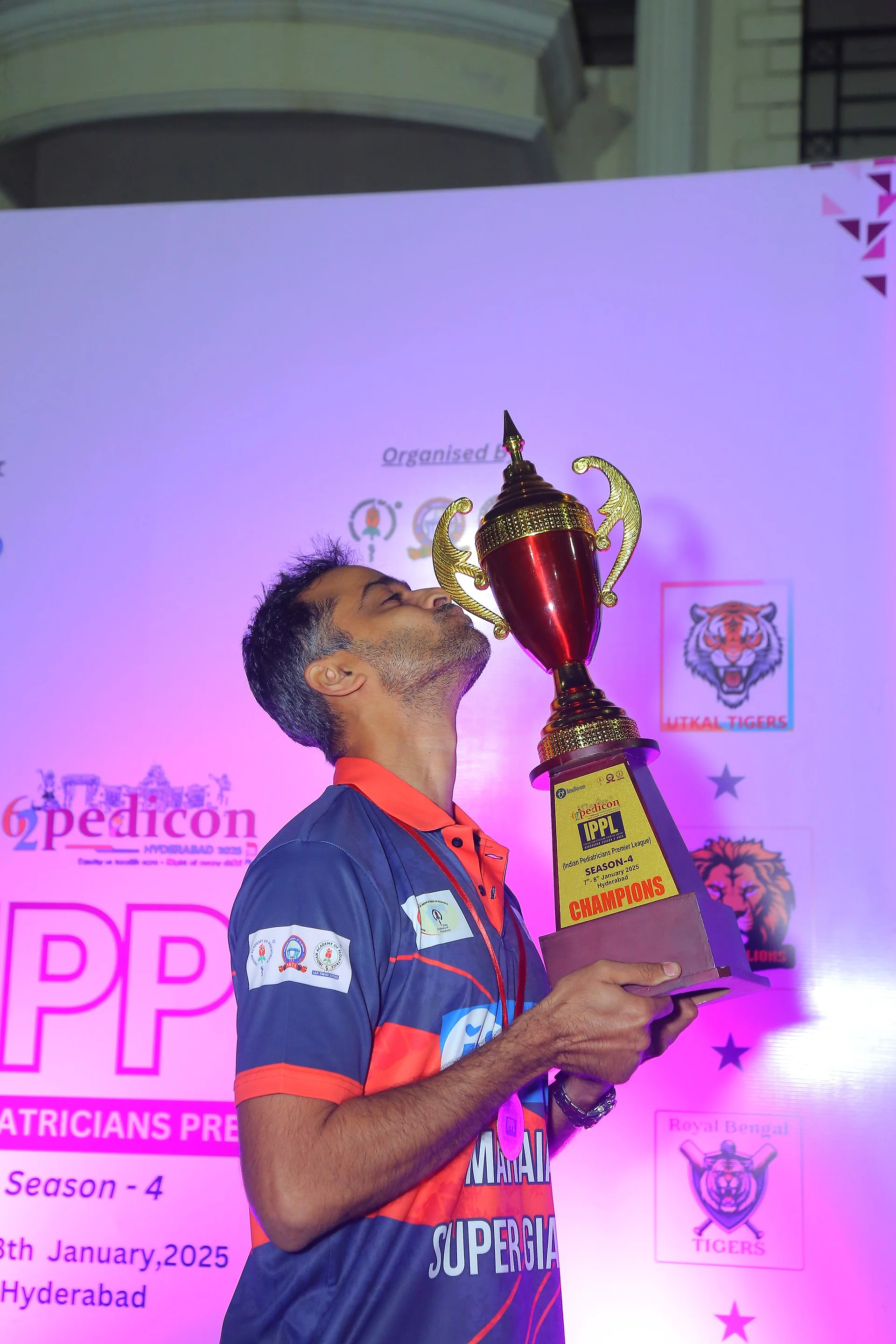 A player kissing the trophy at the IPPL