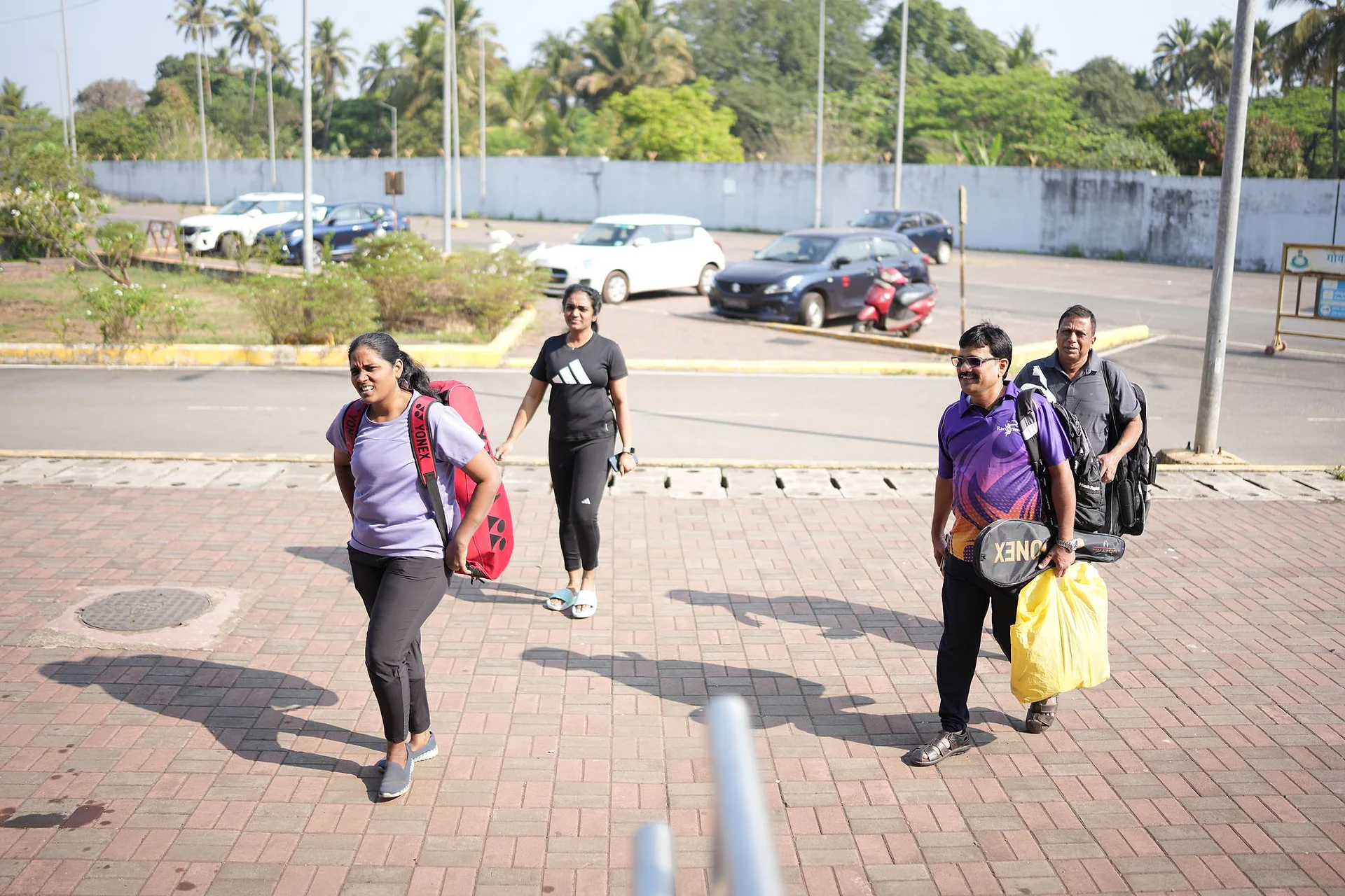 Participants arriving at the venue in Goa carrying their kit bags